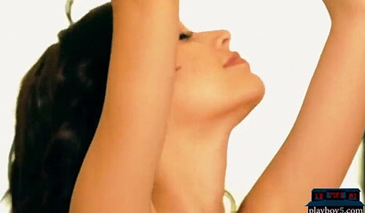 Busty teen beauty shows her round ass and shaved pussy, posing by the swimming pool