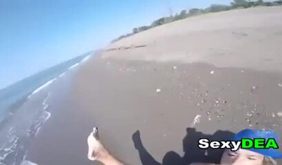 Big bottom teen is sucking a large dick on the beach before her snatch is fucked doggystyle