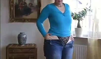 MILF is showing her impressive boobs and fat bottom and plays with her assets while at home