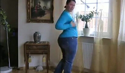 MILF is showing her impressive boobs and fat bottom and plays with her assets while at home