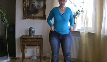 MILF is showing her impressive boobs and fat bottom and plays with her assets while at home