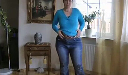 MILF is showing her impressive boobs and fat bottom and plays with her assets while at home