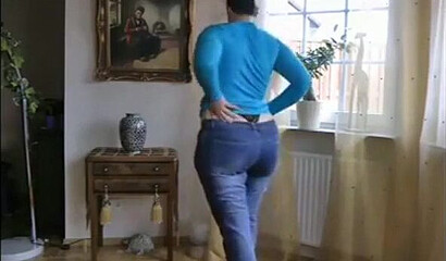 MILF is showing her impressive boobs and fat bottom and plays with her assets while at home