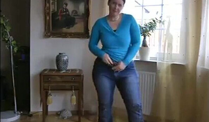 MILF is showing her impressive boobs and fat bottom and plays with her assets while at home