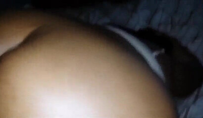 Black babe with an enormous ass takes a hard pounding from the back while squirming gently