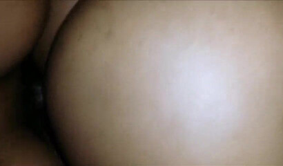 Black babe with an enormous ass takes a hard pounding from the back while squirming gently