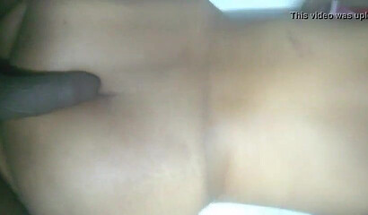 Adorable aunty lays down and massages her big fat ass while making sure that she moans