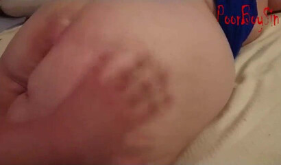 Granny with huge titties lays down on the bed and shows off her huge ass to a young man