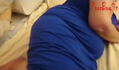 Granny with huge titties lays down on the bed and shows off her huge ass to a young man