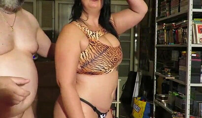 Mature fat ass bitch wearing animal print lingerie gives a blowjob to her fat husband