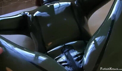 Kinky redhead in latex suit in hardcore BDSM sex