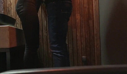 Secret camera catches a young brunette eating cum