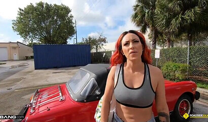 Inked-up redhead blows and rides a mechanic's cock