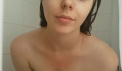 Petite vixen Nadia Foxx is sucking a dildo in the shower