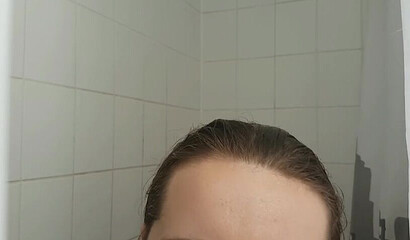 Petite vixen Nadia Foxx is sucking a dildo in the shower