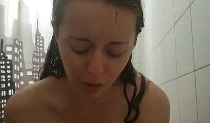 Petite vixen Nadia Foxx is sucking a dildo in the shower