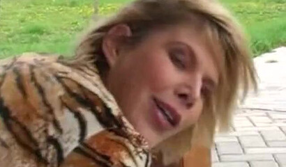 MILF with huge tits rubs her pussy and gets fucked outside