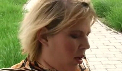 MILF with huge tits rubs her pussy and gets fucked outside