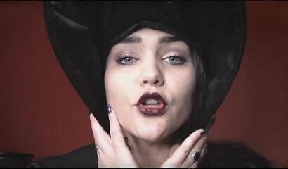 Sexy witch spreads legs and inserts big dildo in her cunt