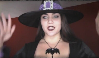 Sexy witch spreads legs and inserts big dildo in her cunt