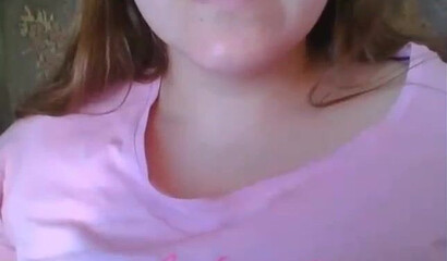 Slutty girl with big tits shows her shaved muff on the webcam