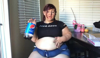 Nasty BBW with big tits drinks and eats