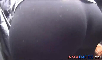 Spy camera recording a big ass babe in leggings while approaching the stage on a festival