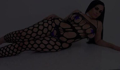 Curvy Latina wearing fishnet bodystocking teasing and shaking her gigantic monster booty