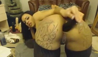 Hot slutty Latina rubbing her clitty and plugging her big tattooed ass with a huge dildo
