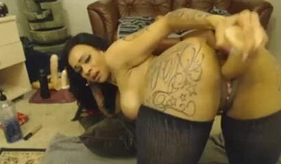 Hot slutty Latina rubbing her clitty and plugging her big tattooed ass with a huge dildo