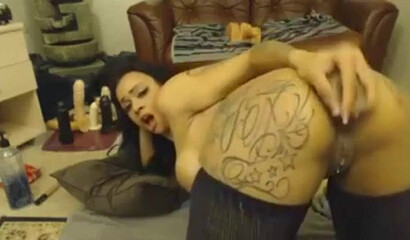 Hot slutty Latina rubbing her clitty and plugging her big tattooed ass with a huge dildo