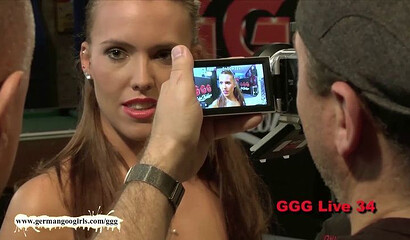 Curvy German brunette with big ass is ready to take on a bunch of guys in a huge bukkake show