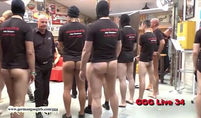 Curvy German brunette with big ass is ready to take on a bunch of guys in a huge bukkake show