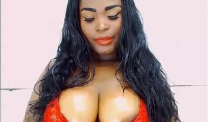 Attractive ebony bitch in red lingerie bouncing and twerking her giant booty on webcam