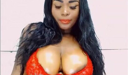 Attractive ebony bitch in red lingerie bouncing and twerking her giant booty on webcam