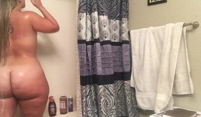 Gal with an enormous booty bends over and shows it all off for the camera as she moans