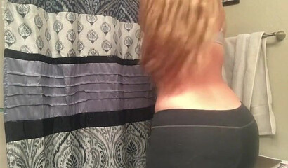 Gal with an enormous booty bends over and shows it all off for the camera as she moans