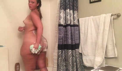 Gal with an enormous booty bends over and shows it all off for the camera as she moans