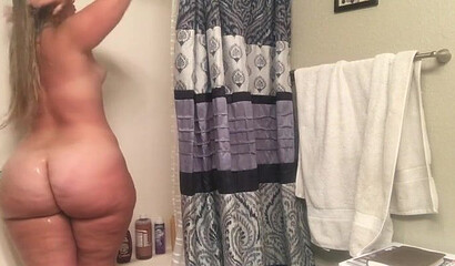 Gal with an enormous booty bends over and shows it all off for the camera as she moans