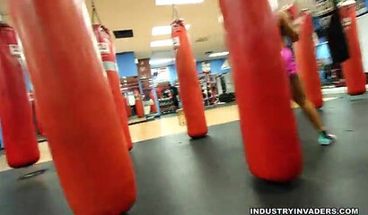 Two big booty cuties show off their amazing assets in the gym while they work out hard
