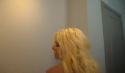 Mature blonde MILF with huge tits rubbing her clam in solo action