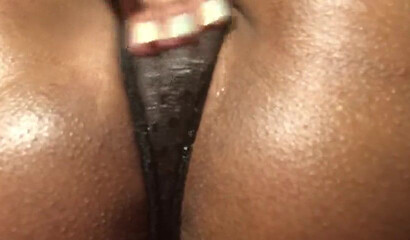 Horny ebony with big booty rubs her fat snatch close up