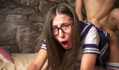 Brunette schoolgirl with nerdy look gets hard fucked in doggystyle
