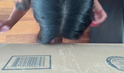 Latina MILF with big boobs strips kneels and sucks dick from the box