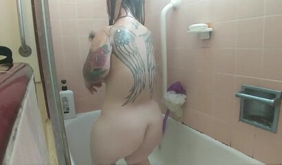 Amateur brunette with huge natural tits and ass under the shower
