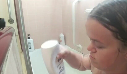 Amateur brunette with huge natural tits and ass under the shower