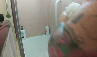 Amateur brunette with huge natural tits and ass under the shower