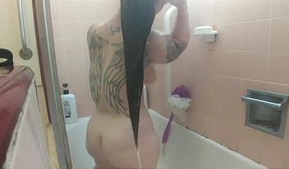 Amateur brunette with huge natural tits and ass under the shower