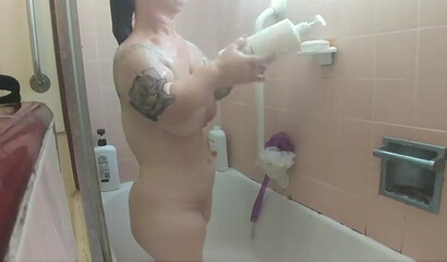 Amateur brunette with huge natural tits and ass under the shower