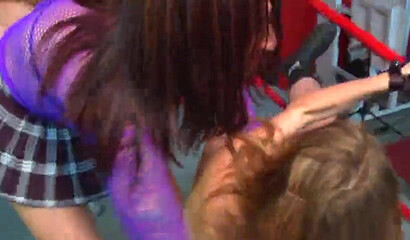 Busty lesbian fighters grab and fuck each other in the ring